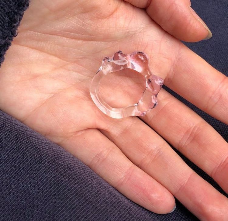 Soft Organic Glass Ring 0105 in baby pink hand-sculpted borosilicate glass, held in the hand, Rain and Rivers