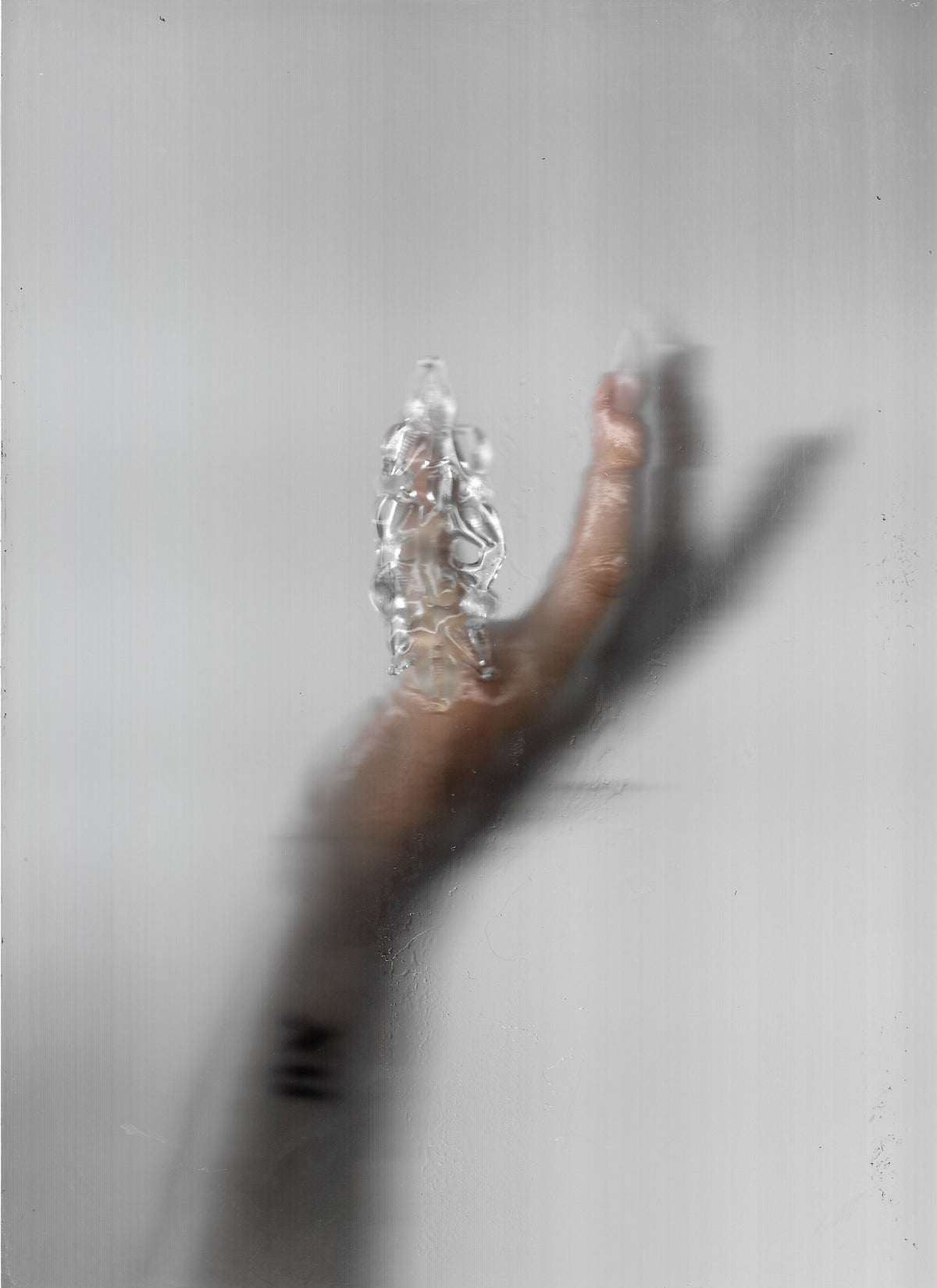 Thorn Glass Ring 0134 in clear hand-sculpted borosilicate glass, worn on the finger, Rain and Rivers