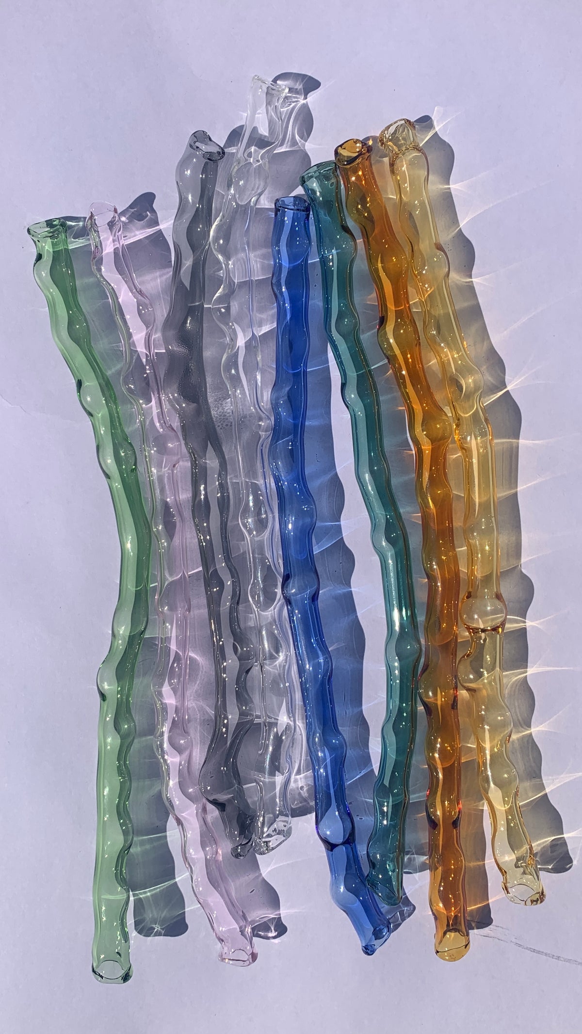 Straw 0001 in hand-sculpted borosilicate glass, shown in the range of colours, Rain and Rivers