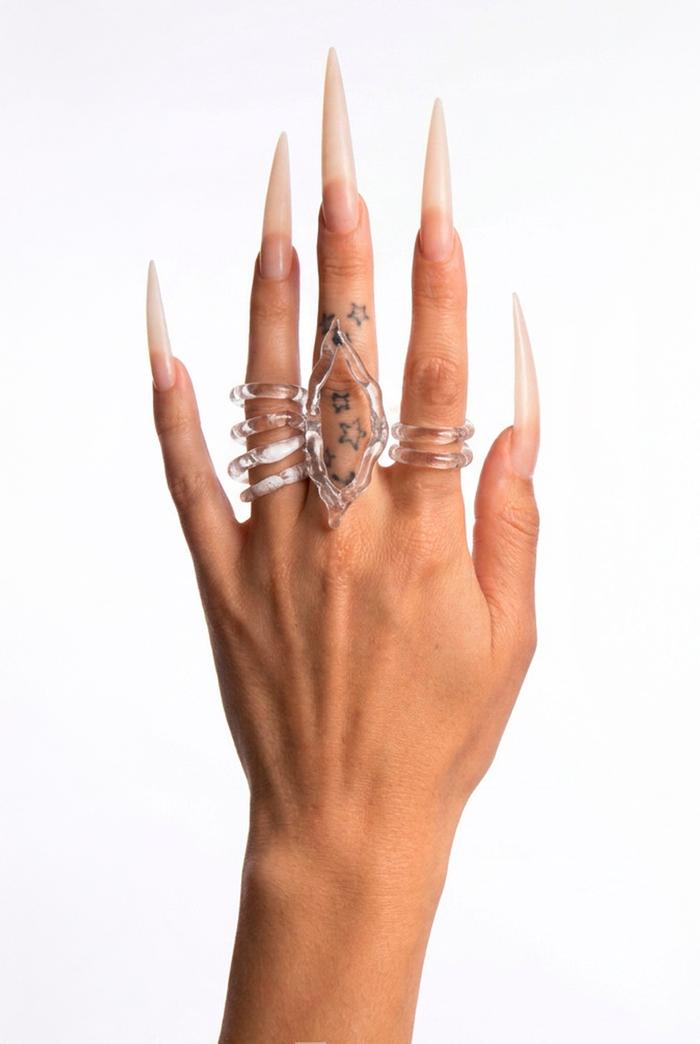 Hand-sculpted borosilicate glass rings by Rain and Rivers, worn on the hand