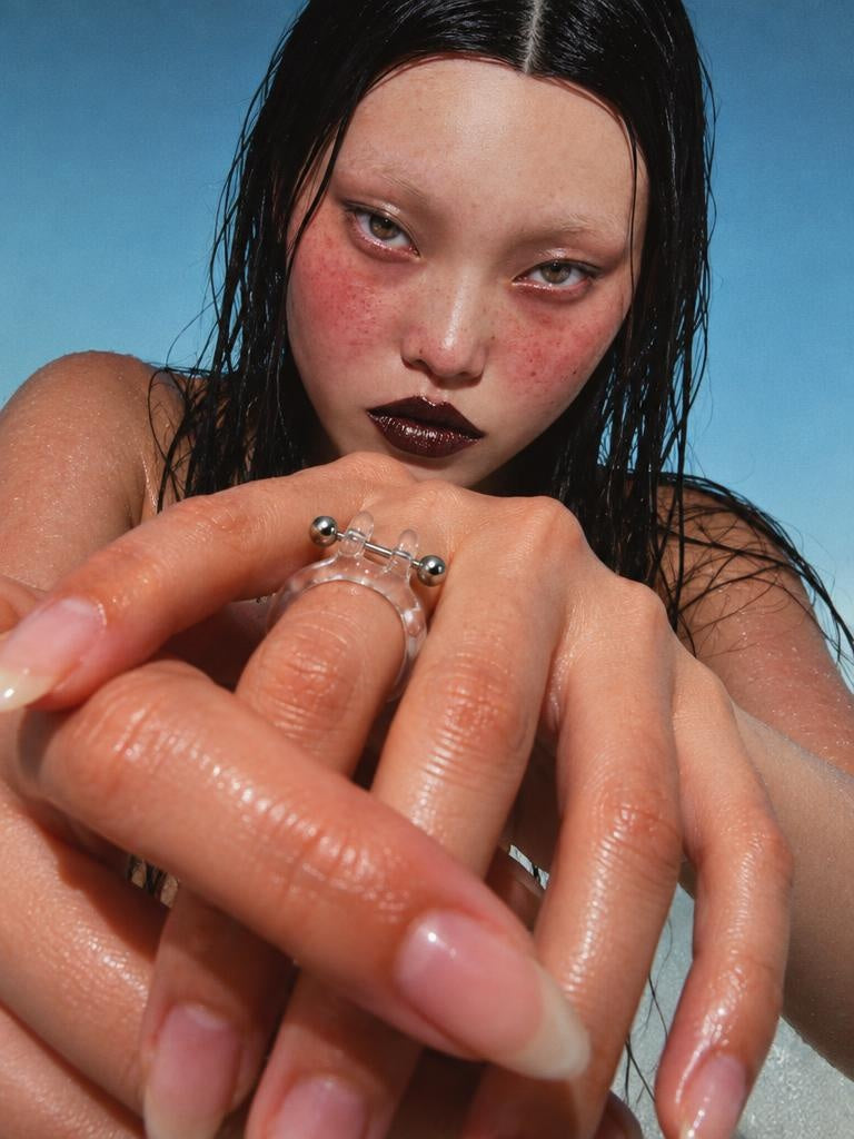 Barbell Piercing Glass Ring 0076, campaign photograph with saturated flash, glass and stainless steel, Rain and Rivers