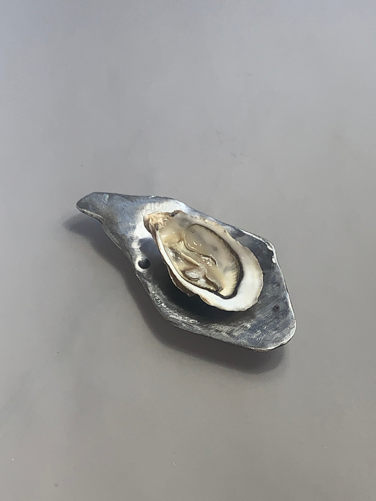 Ostra 0004 in coated iron, Rain and Rivers with María Chidan