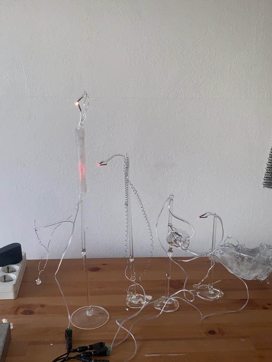 Acción y Destino (2026), lighting choreography with motorized sculptures and glass lamps by Magdalena Hart, image 3 of 11