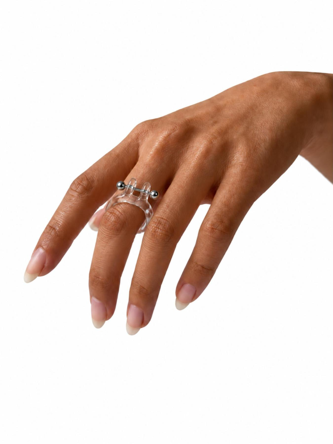 Barbell Piercing Glass Ring 0076 by Rain and Rivers: a handmade clear glass ring pierced with a stainless steel barbell, worn on the hand, on a white background