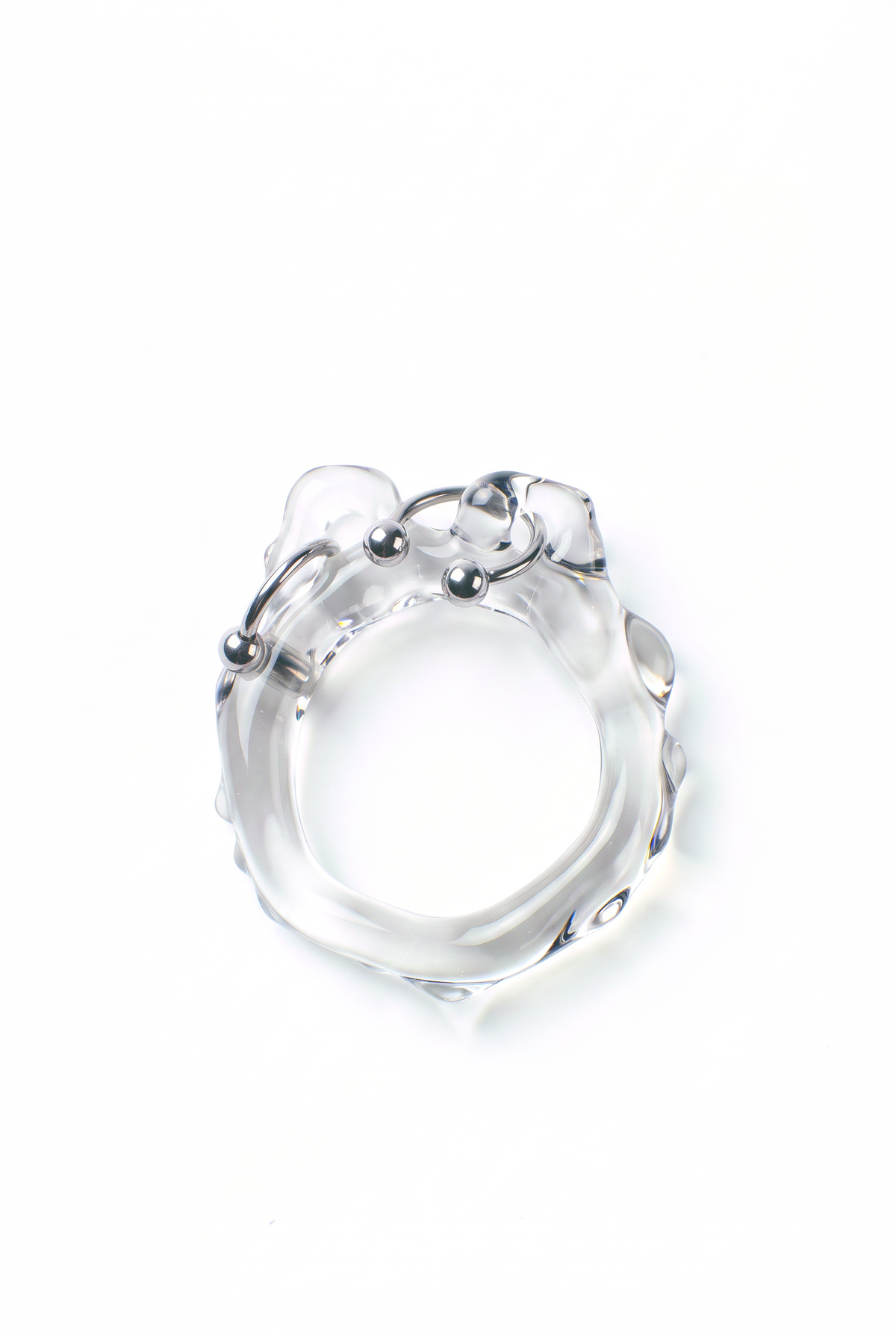 Rain and Rivers Organic Pierced Glass Ring 0062 – hand-sculpted organic clear borosilicate glass ring with steel piercing detail, handmade in Barcelona, product photo on white