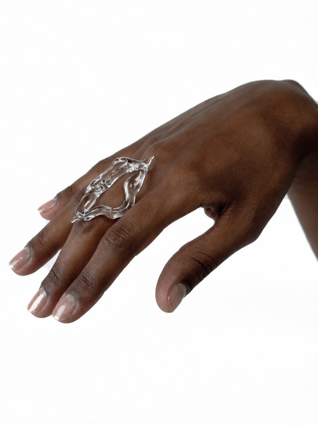 Rombo Sculptural Glass Ring 0111 in clear hand-sculpted borosilicate glass, worn on the hand, Rain and Rivers