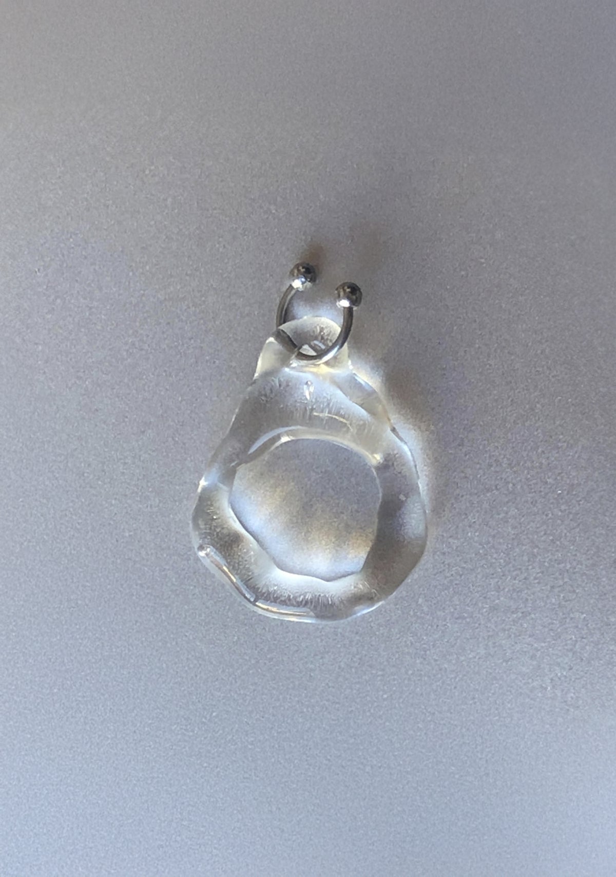 Pierced Glass Ring 0001, clear glass with a stainless steel horseshoe piercing, detail, Rain and Rivers